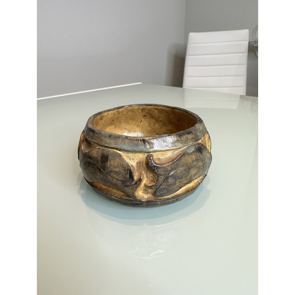 antique stone vase with ornament in the form of‎ fish